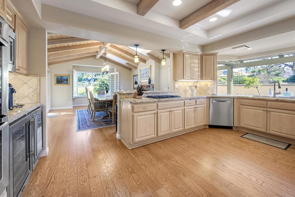 16142 El Tae Road Pauma Valley, CA 92061 - Photo 14 of 63 a kitchen with lots of counter top space and wooden floor