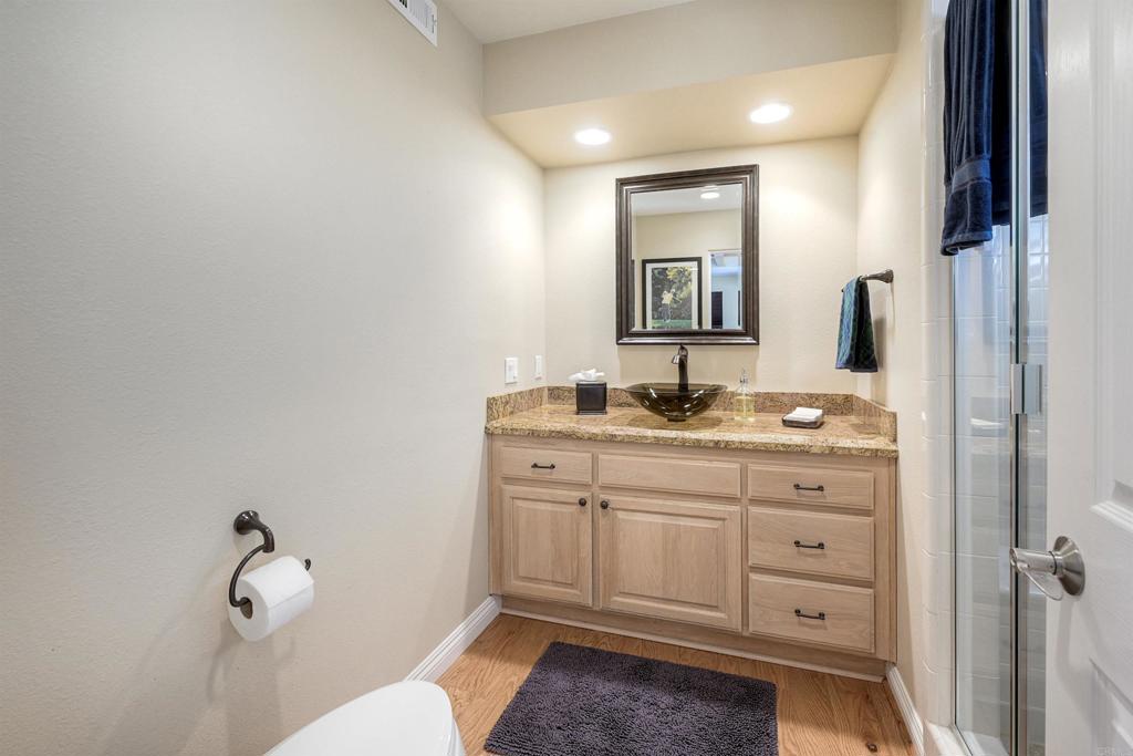 16142 El Tae Road Pauma Valley, CA 92061 - Photo 19 of 63 a bathroom with a sink a vanity and mirror
