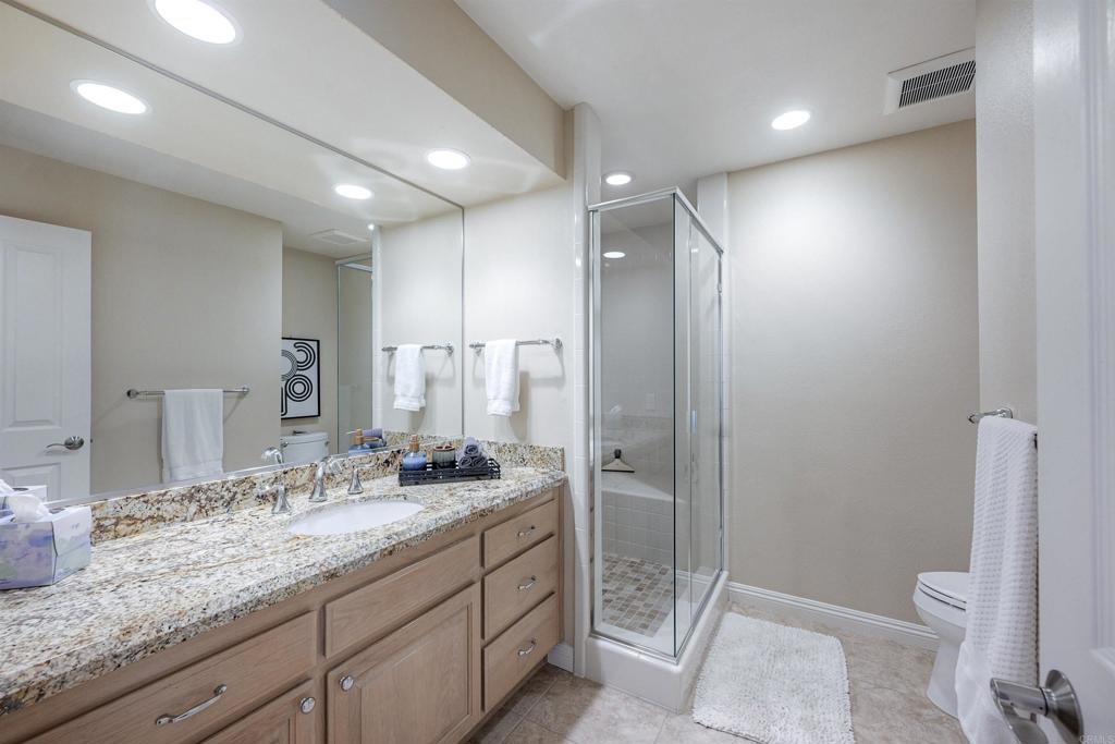 16142 El Tae Road Pauma Valley, CA 92061 - Photo 22 of 63 a bathroom with a granite countertop sink mirror and toilet