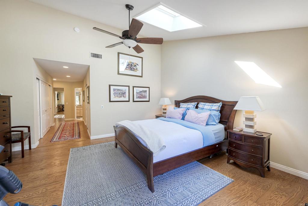 16142 El Tae Road Pauma Valley, CA 92061 - Photo 25 of 63 a bedroom with a bed and a table