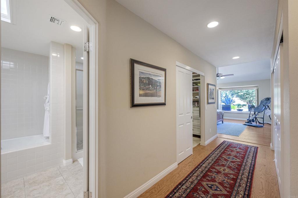 16142 El Tae Road Pauma Valley, CA 92061 - Photo 26 of 63 a hallway with furniture and a rug