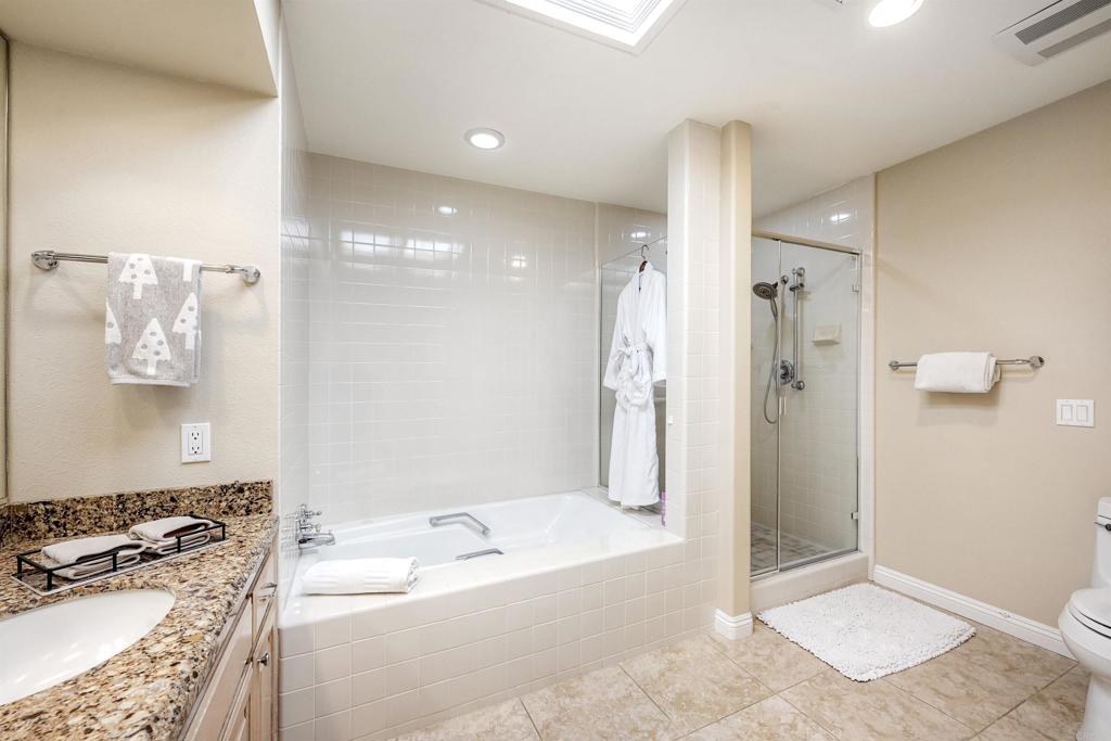 16142 El Tae Road Pauma Valley, CA 92061 - Photo 28 of 63 a spacious bathroom with a tub shower and sink