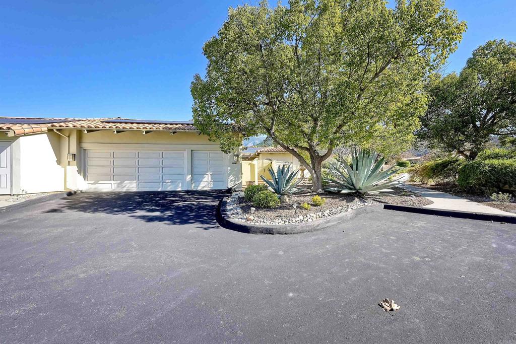 16142 El Tae Road Pauma Valley, CA 92061 - Photo 3 of 63 a view of a house with a yard and garage