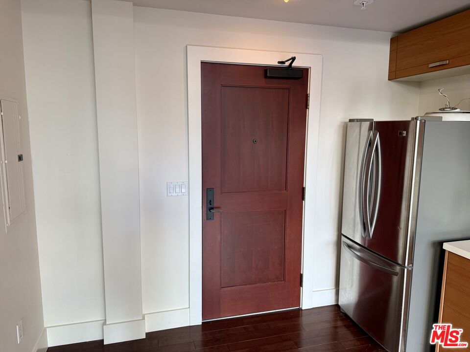 460 South Spring Street, Unit 205 Los Angeles, CA 90013 - Photo 3 of 18 a metallic refrigerator freezer sitting in a kitchen