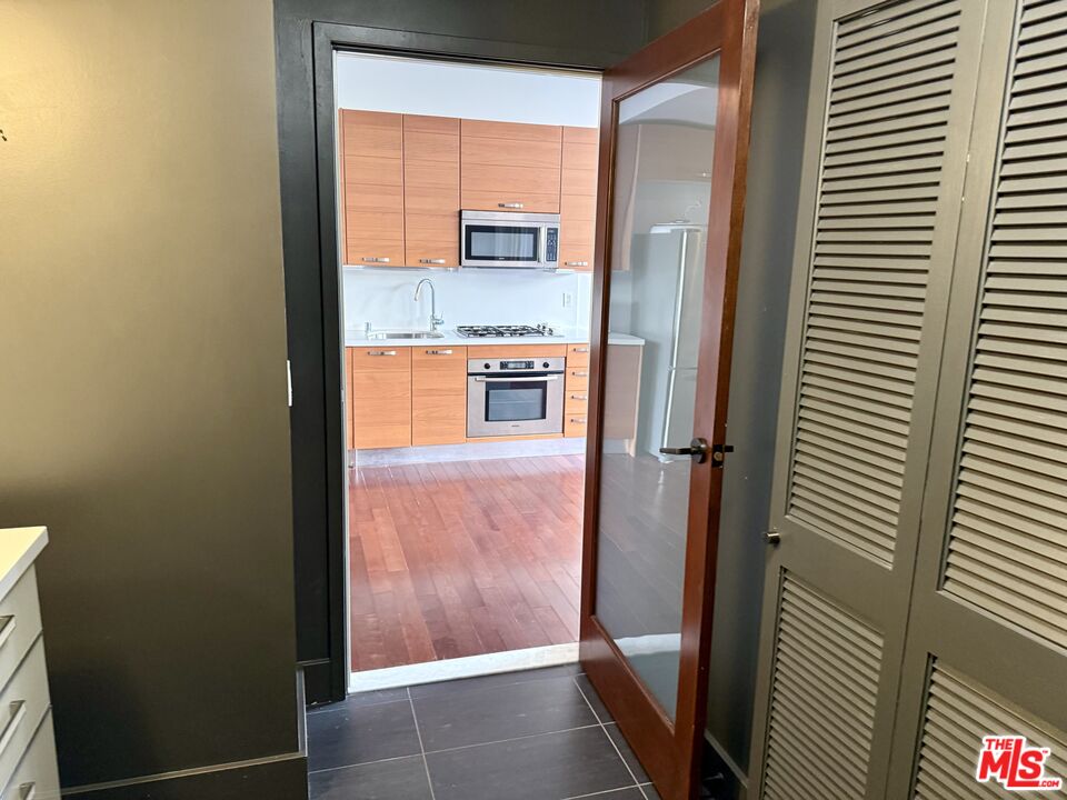 460 South Spring Street, Unit 205 Los Angeles, CA 90013 - Photo 4 of 18 a bathroom with a sink and a mirror