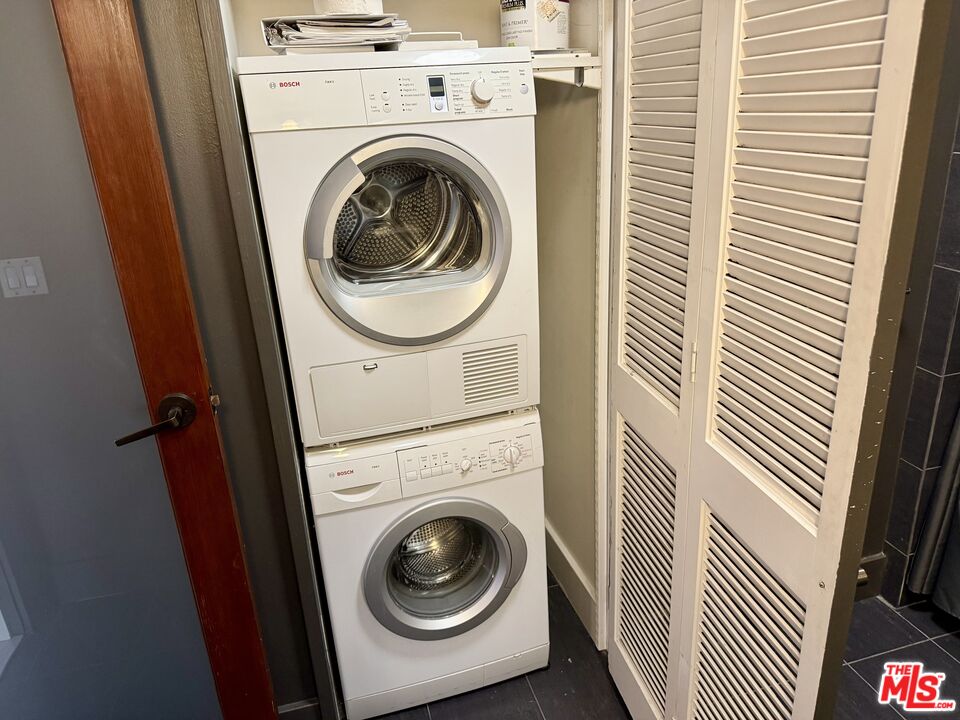 460 South Spring Street, Unit 205 Los Angeles, CA 90013 - Photo 6 of 18 a utility room with dryer and washer