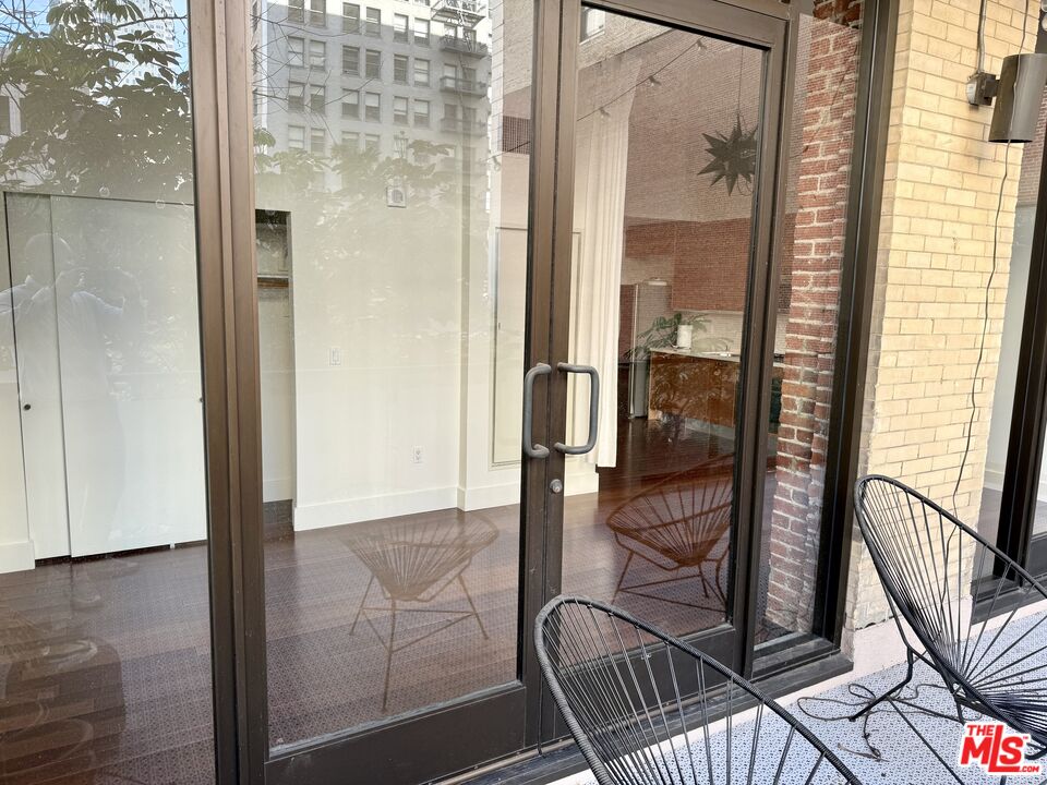 460 South Spring Street, Unit 205 Los Angeles, CA 90013 - Photo 10 of 18 a view of a balcony with a door