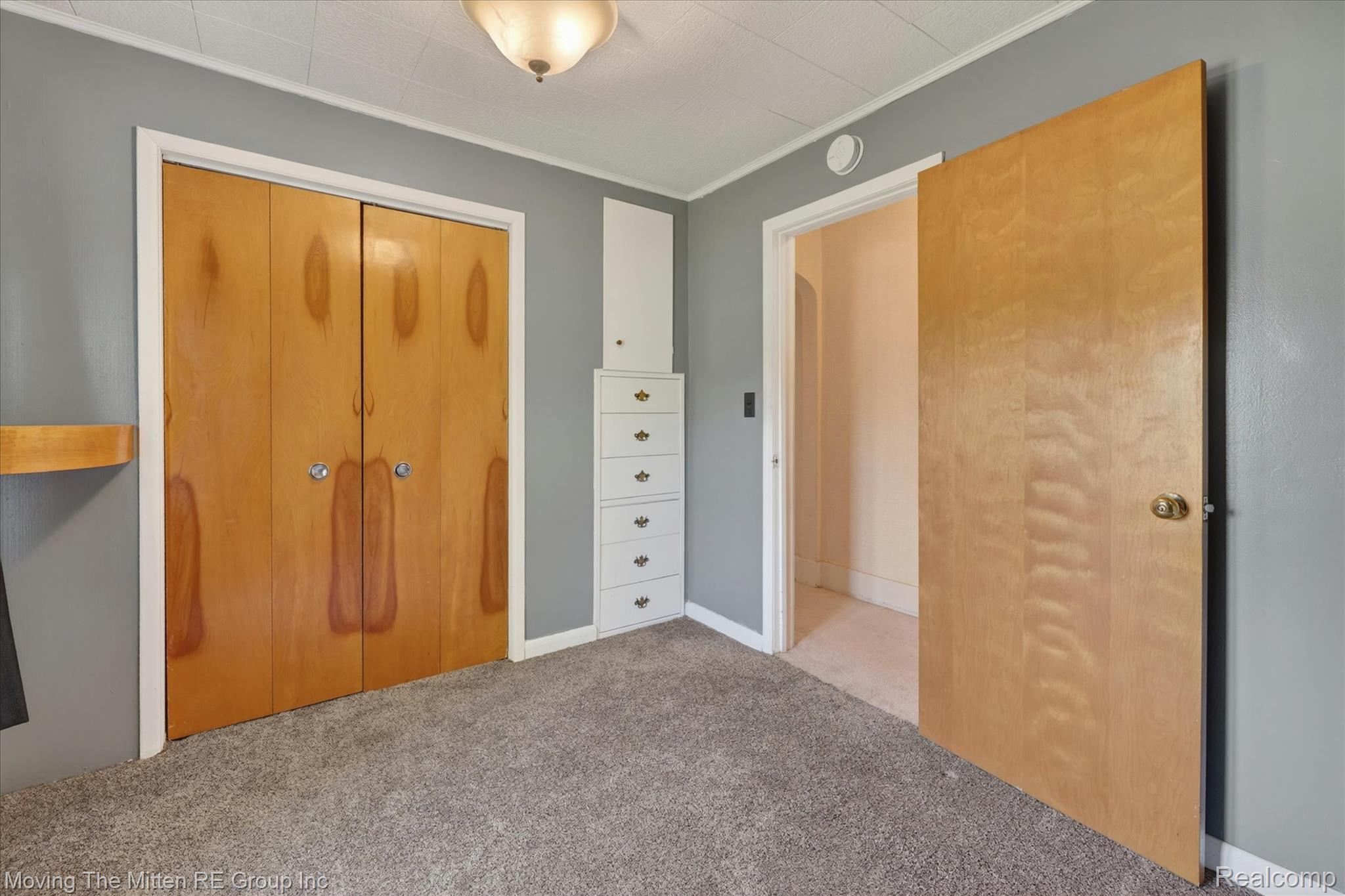 25505 Wick Road Taylor, MI 48180 - Photo 21 of 68 Unfurnished bedroom with carpet, a closet, and crown molding