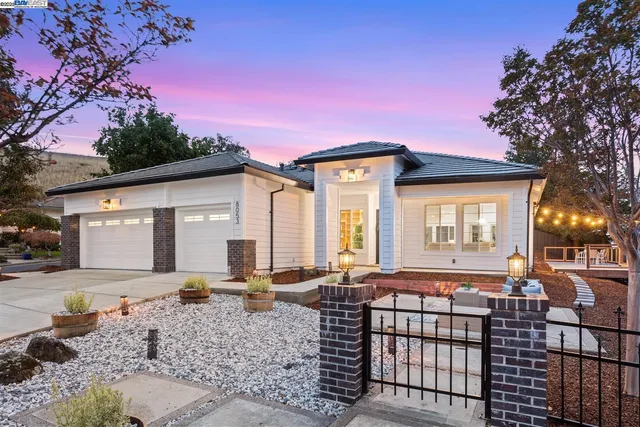 a front view of a house with yard
