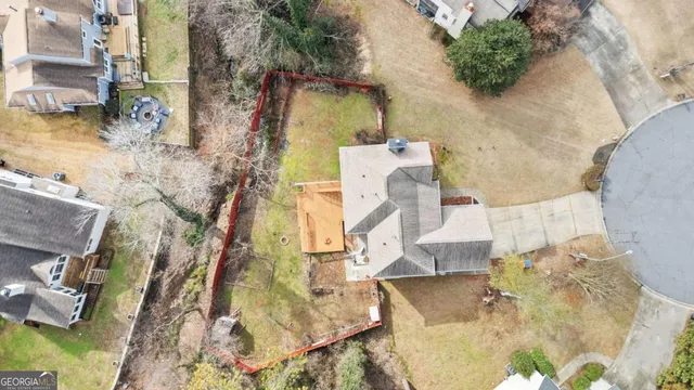 an aerial view of residential houses with outdoor space