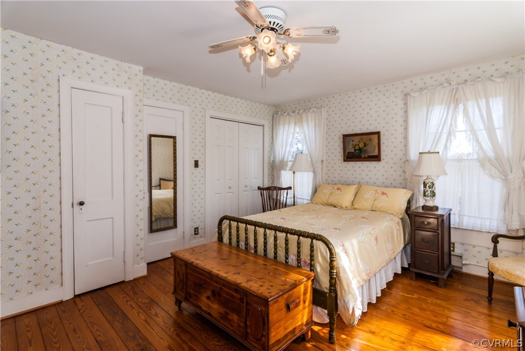 11513 Beach Road Chesterfield, VA 23838 - Photo 20 of 29 a bedroom with a bed chandelier and a window
