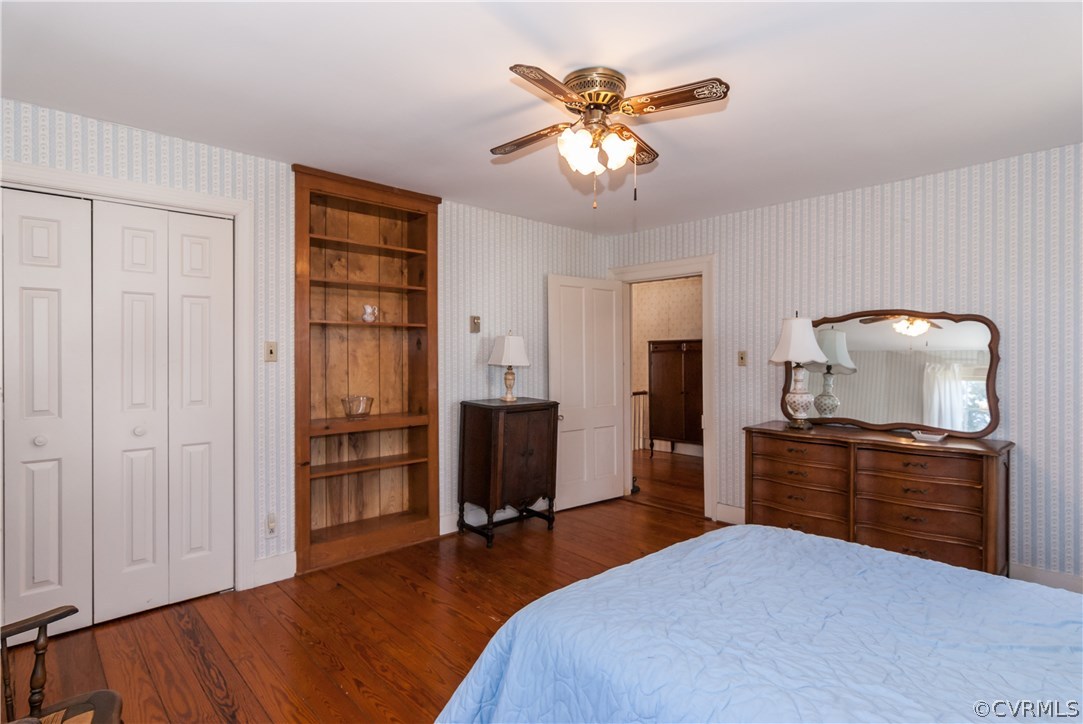 11513 Beach Road Chesterfield, VA 23838 - Photo 23 of 29 a bedroom with a bed and a chandelier