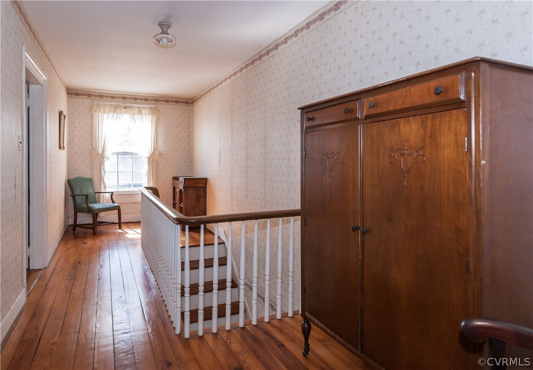 11513 Beach Road Chesterfield, VA 23838 - Photo 25 of 29 a view of a hallway with workspace and wooden floor