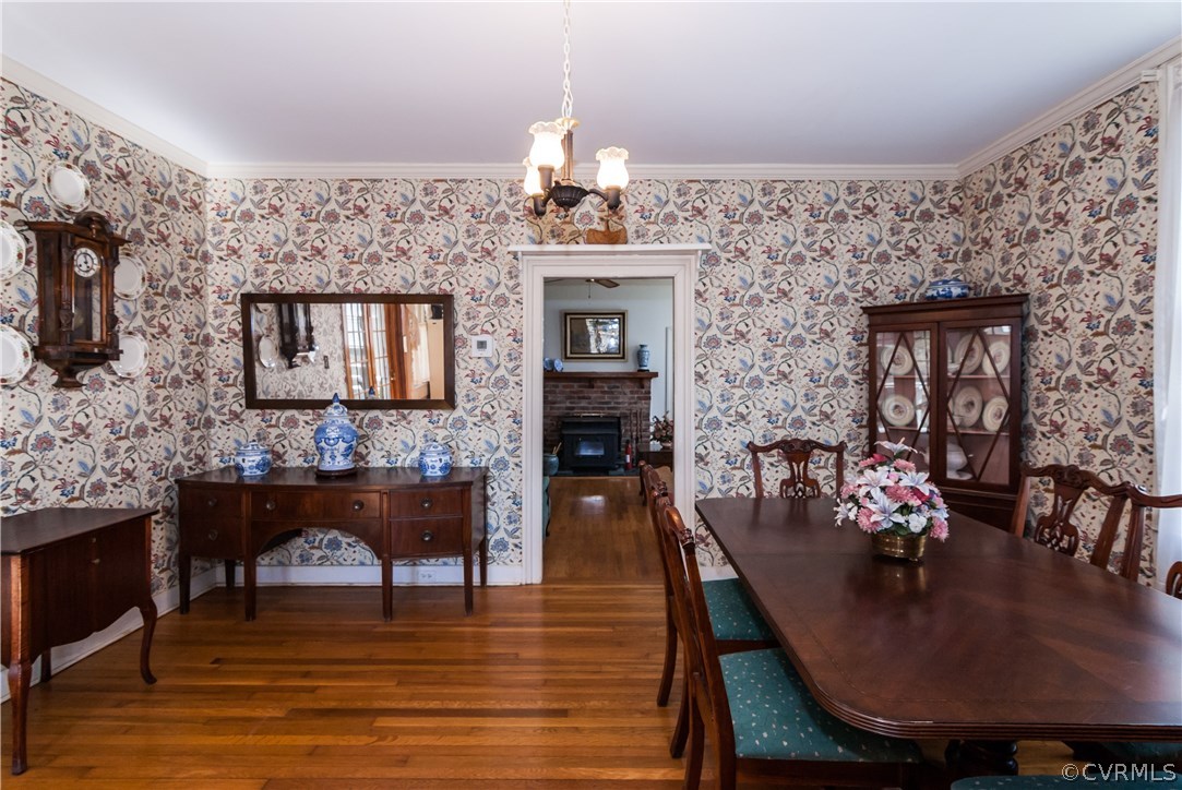 11513 Beach Road Chesterfield, VA 23838 - Photo 8 of 29 a dining room with furniture a chandelier and wooden floor