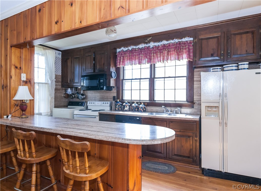 11513 Beach Road Chesterfield, VA 23838 - Photo 9 of 29 a kitchen with a dining table chairs and refrigerator