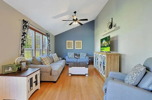 a living room with furniture and a large window