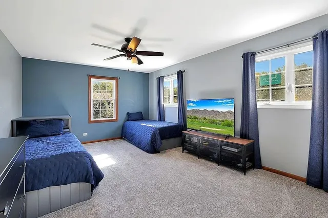 a bedroom with furniture and a window