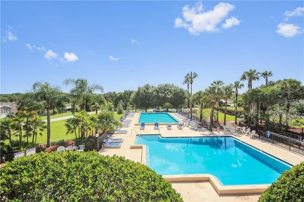 a view of a swimming pool with a patio