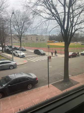 a view of a street with cars