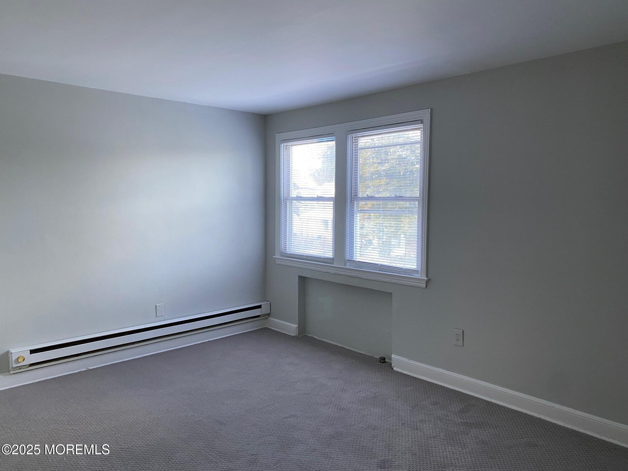 20 Oldfield Place Red Bank, NJ 07701 - Photo 3 of 11 an empty room with a window