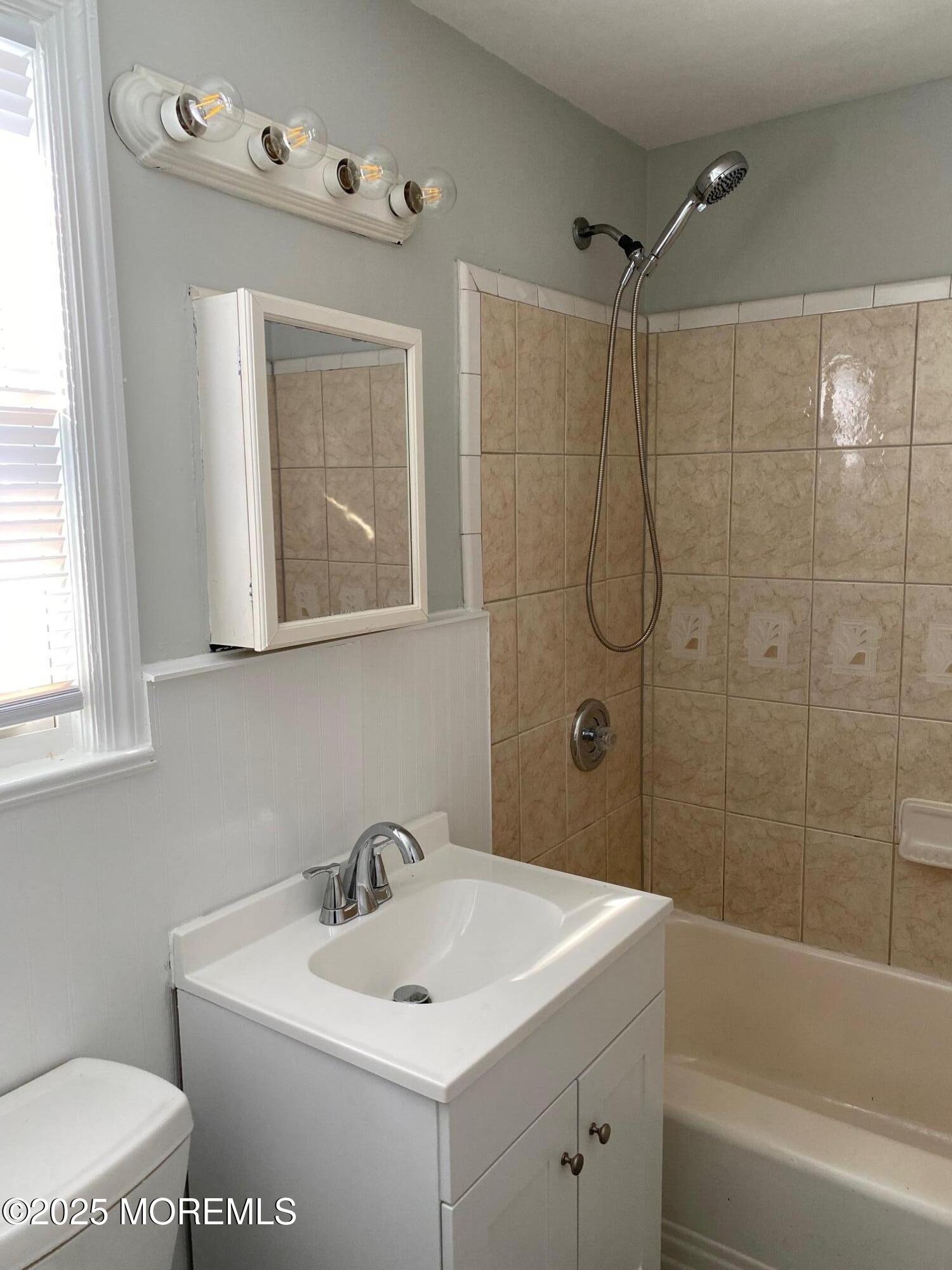 20 Oldfield Place Red Bank, NJ 07701 - Photo 9 of 11 a bathroom with a sink a toilet and shower