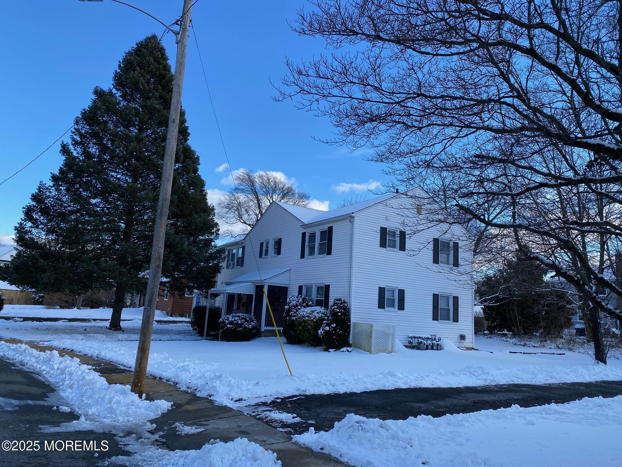 20 Oldfield Place Red Bank, NJ 07701 - Photo 10 of 11 a view of a large building with a yard