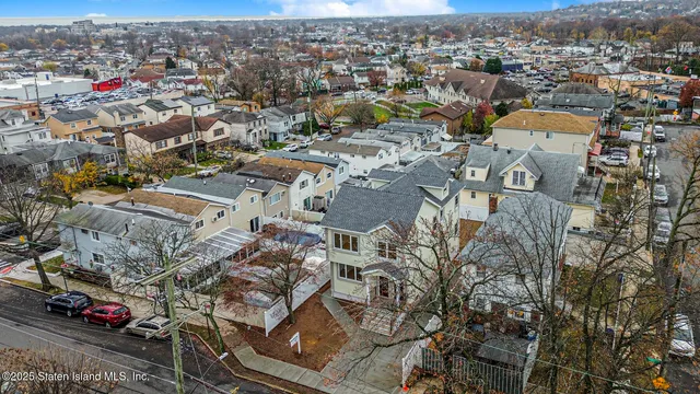 an aerial view of a city with lots of residential buildings