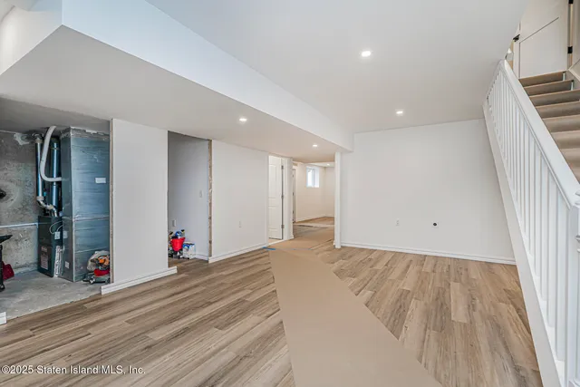 a view of room with wooden floor and window