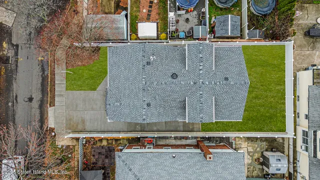 an aerial view of a swimming pool with outdoor space