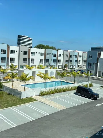 a view of a building with a swimming pool