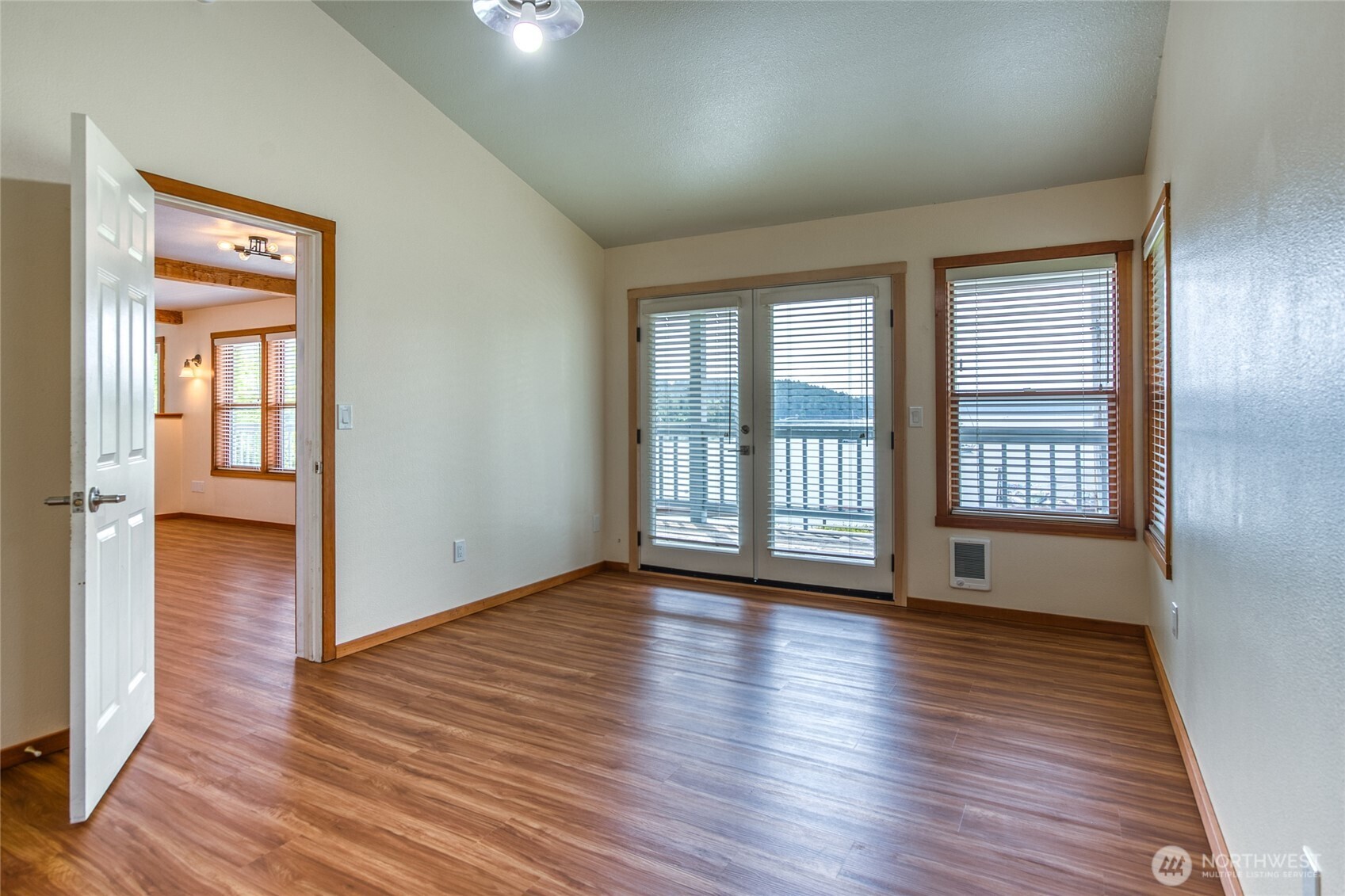 942 Deer Harbor Road Orcas Island, WA 98245 - Photo 13 of 40 a view of an empty room with wooden floor and a window