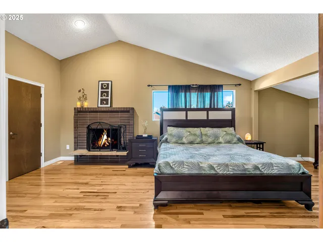 a bed room with a bed and a fireplace