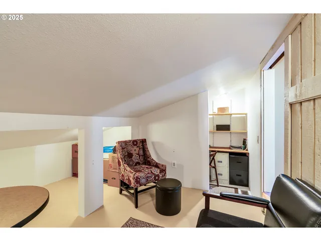 a living room with furniture a rug and a fireplace