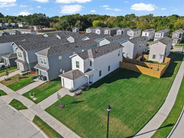 an aerial view of a house with a garden
