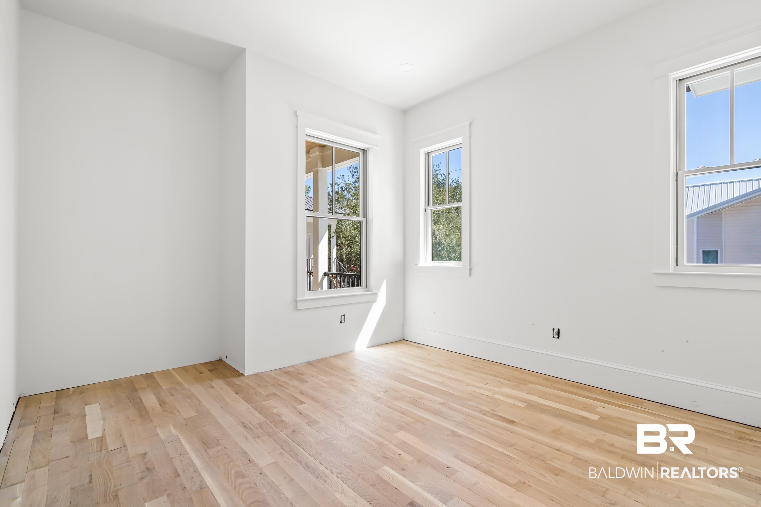 14686 State Highway Gulf Shores, AL 36542 - Photo 21 of 44 Empty room featuring wood finished floors