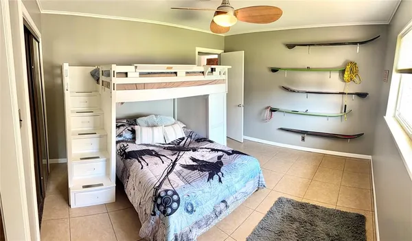 a bedroom with a bed and a mirror