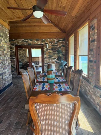 a view of a dining room with furniture wooden floor and a chandelier