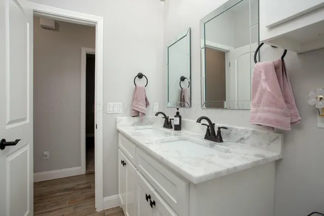 a bathroom with a sink and a mirror