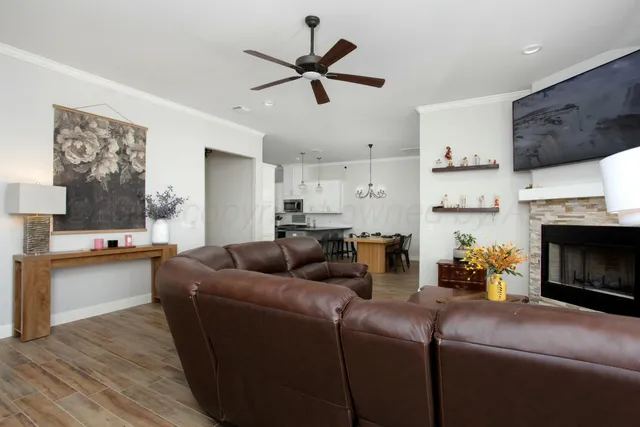 a living room with furniture and a fireplace