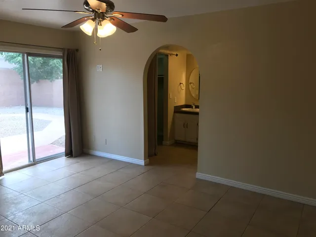 a white toilet sitting next to a shower