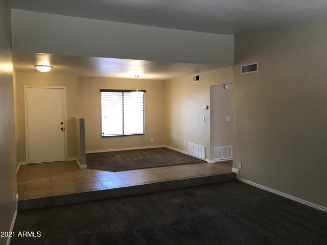 a view of an empty room and window