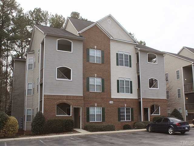 7024 Sandy Forks Road, Unit 301 Raleigh, NC 27615 - Photo 1 of 11 a car parked in front of a building
