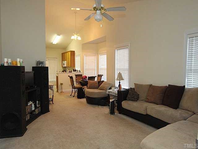 7024 Sandy Forks Road, Unit 301 Raleigh, NC 27615 - Photo 2 of 11 a living room with furniture and a flat screen tv