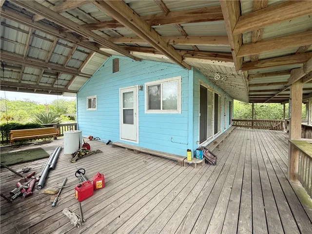 a view of outdoor space with wooden floor