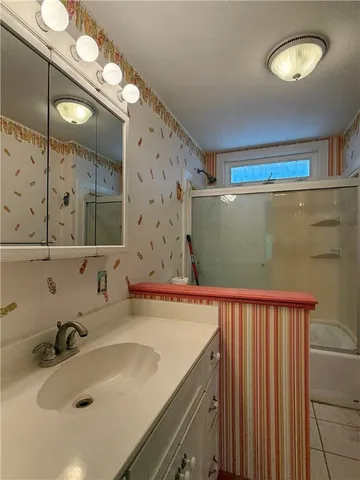 a bathroom with a sink and a mirror