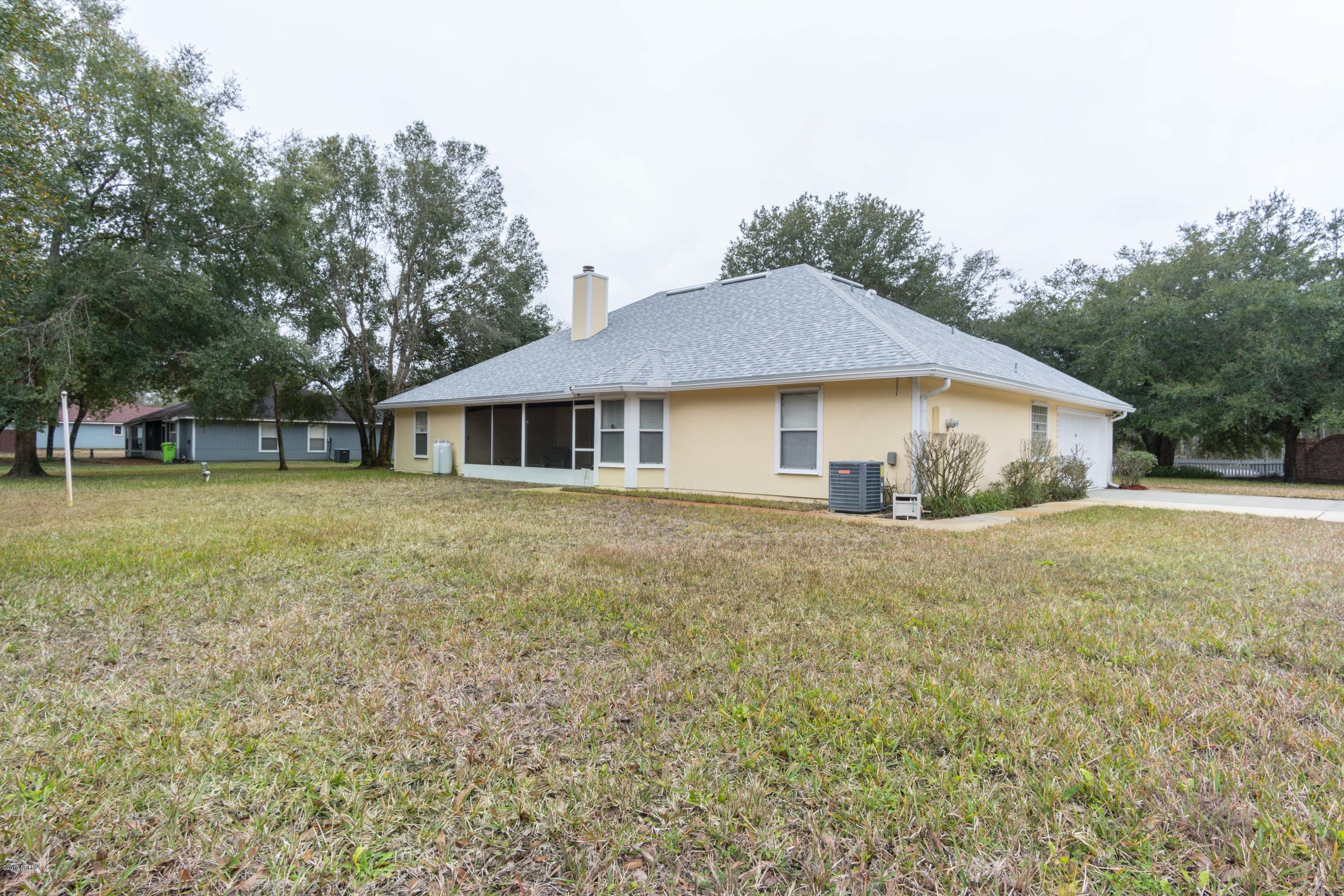 96406 Chester Road Yulee, FL 32097 - Photo 5 of 31 a house with trees in the background