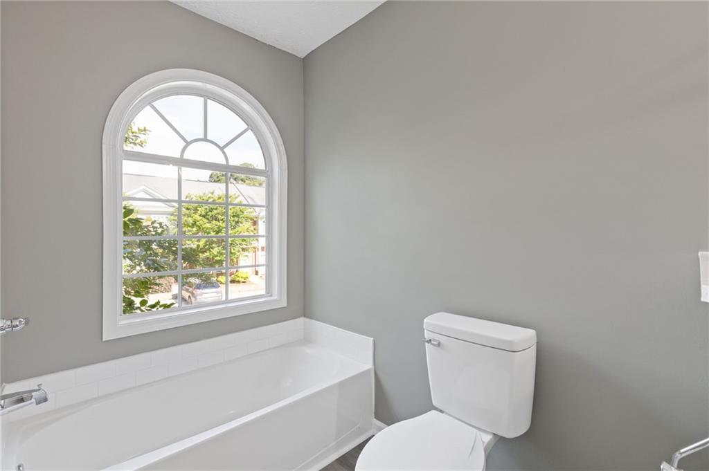 2566 Walden Lake Drive Decatur, GA 30035 - Photo 24 of 30 a white toilet sitting next to a window