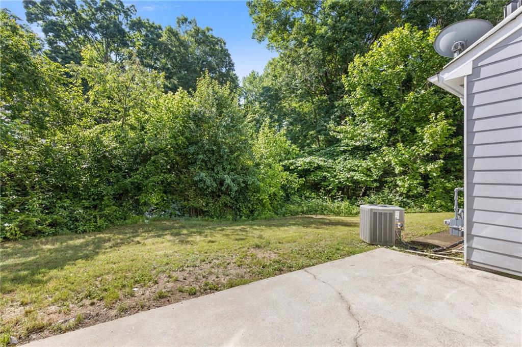 2566 Walden Lake Drive Decatur, GA 30035 - Photo 26 of 30 a backyard of a house with a lots of green space