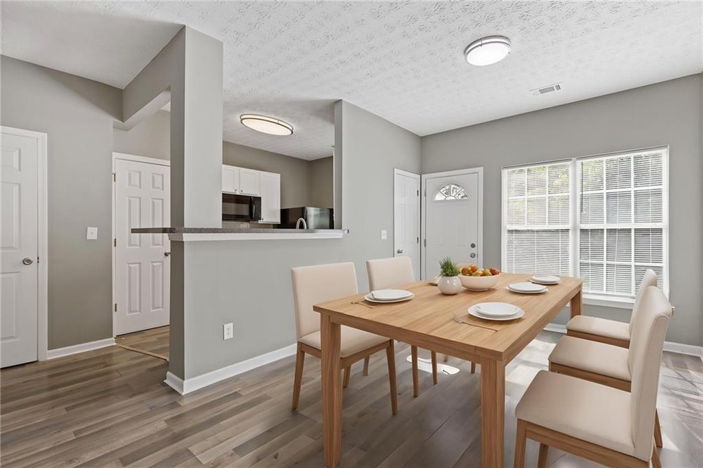 2566 Walden Lake Drive Decatur, GA 30035 - Photo 10 of 30 a view of a dining room with furniture window and wooden floor