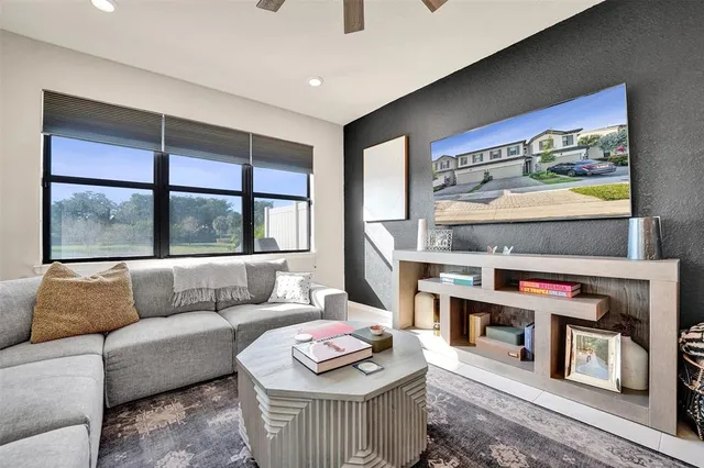 a living room with furniture and a large window
